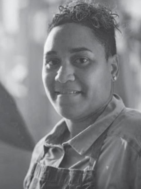 Smiling woman in a denim jacket